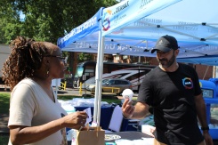 Rami Hussien engaging with a community member at the Fisk Jazz Fest