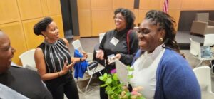 Co-host Dr. Cook (2nd from the left), Meharry Medical College, sharing a laugh and nugget of wisdom with friends and colleagues.